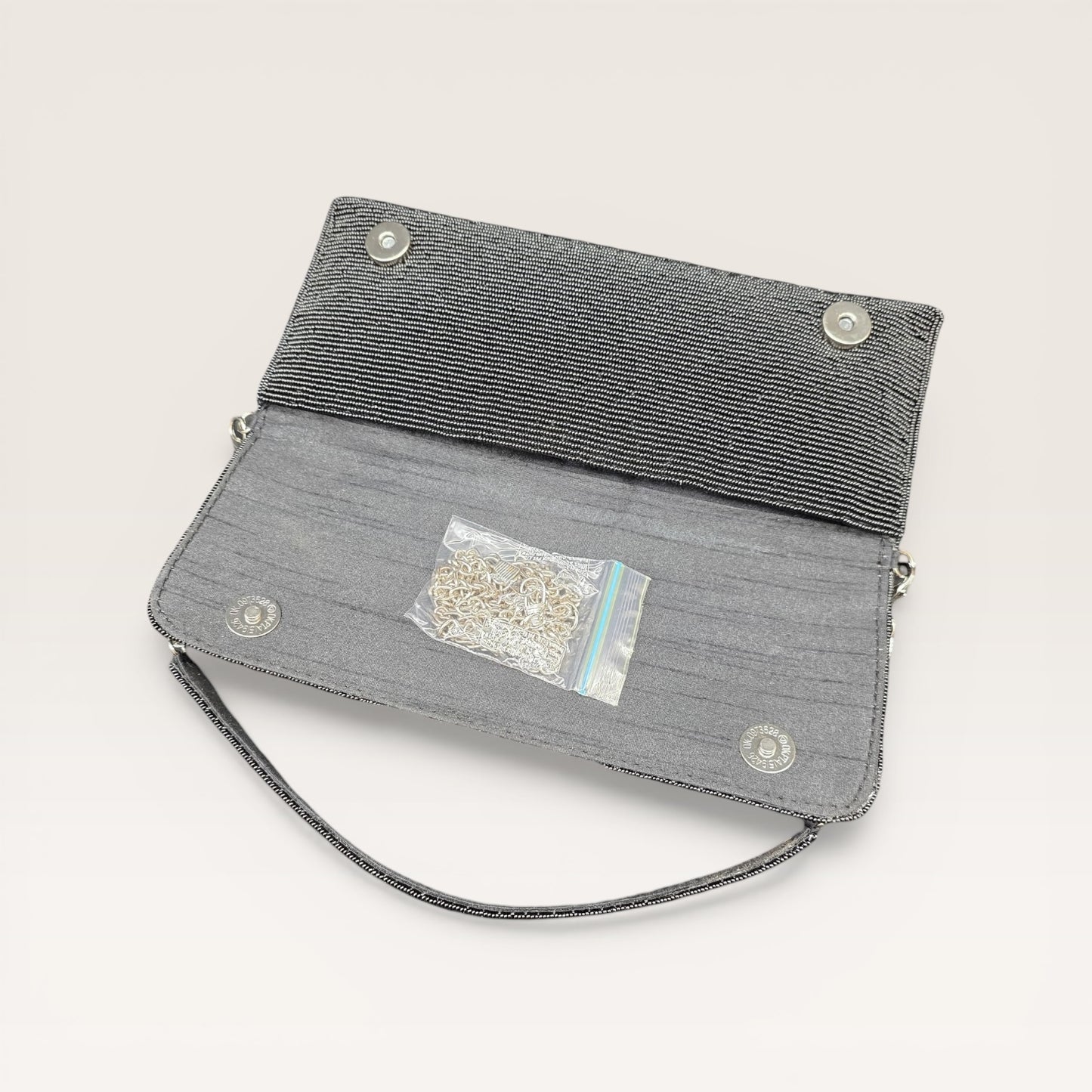 Hand-embroidered pastel bead envelope clutch with gold chain and Kardana work.