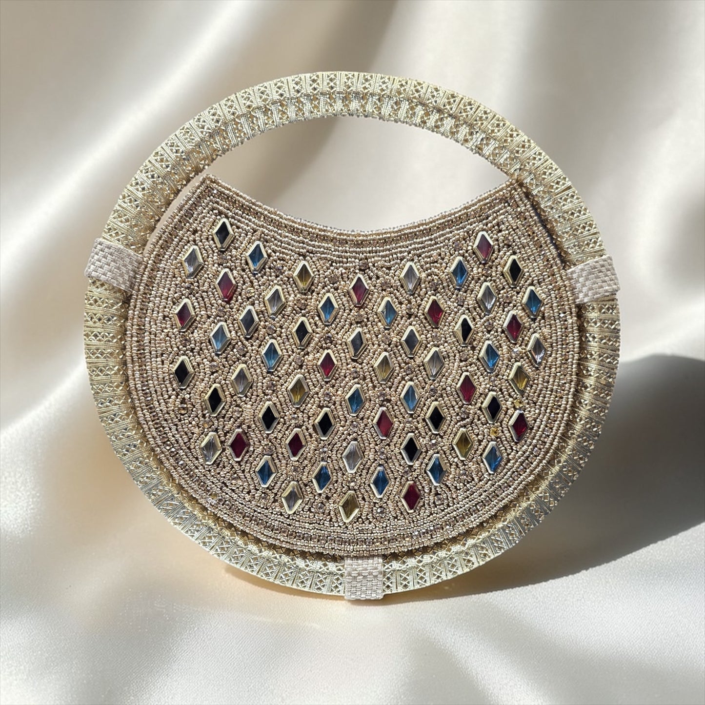 Circular jute handbag with colorful diamond stone embroidery and seed bead details.