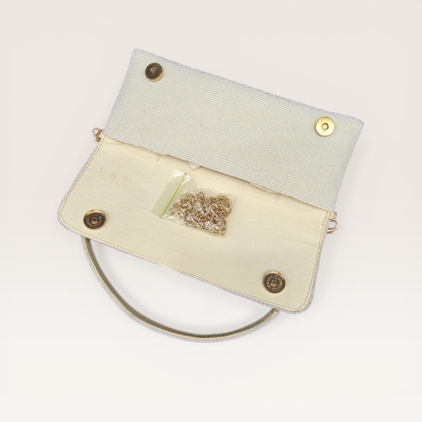 Hand-embroidered pastel bead envelope clutch with gold chain and Kardana work.