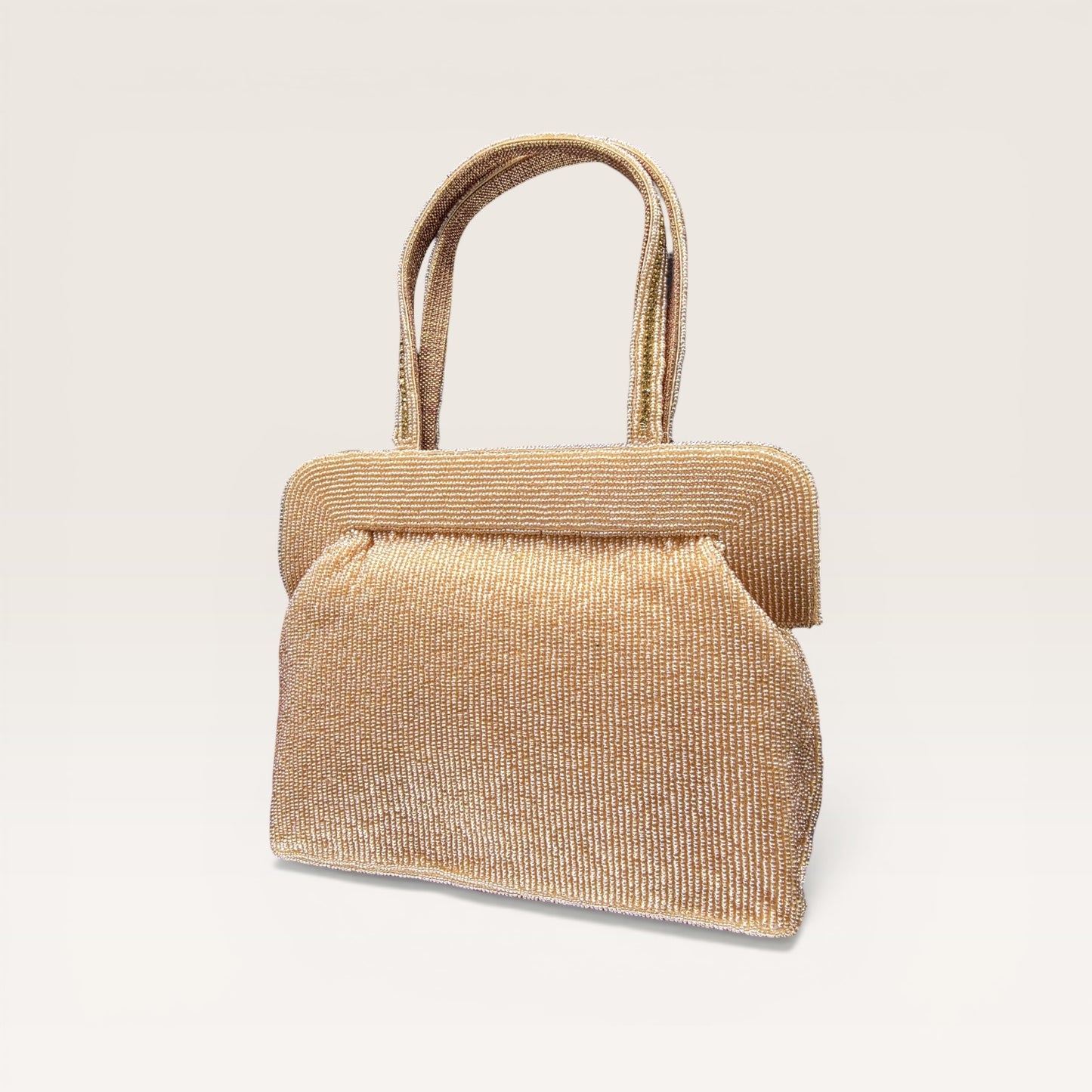 Hand-embroidered seed bead handbag with colorful stone border and twin embroidered handles.