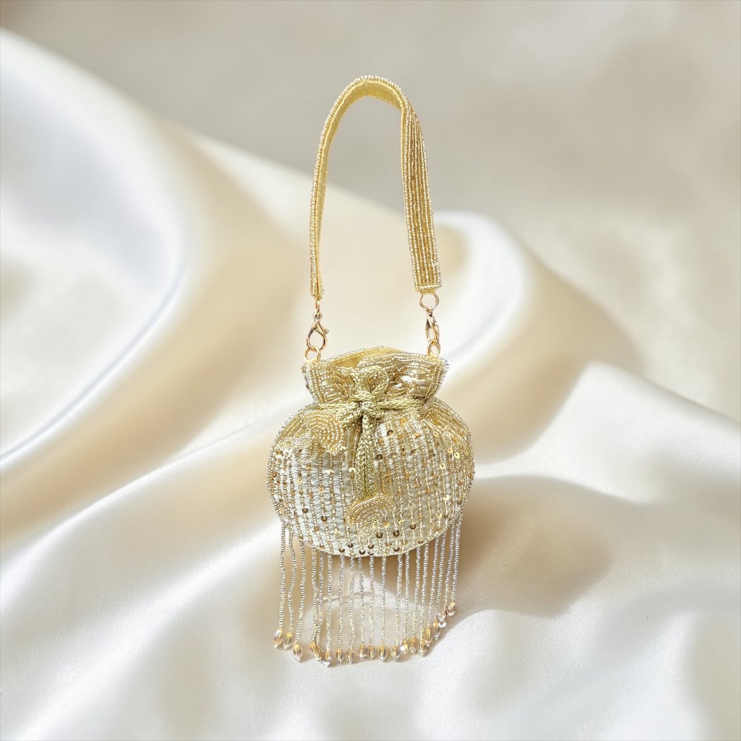Mini velvet potli bag with seed beads and shimmering sequin hand embroidery