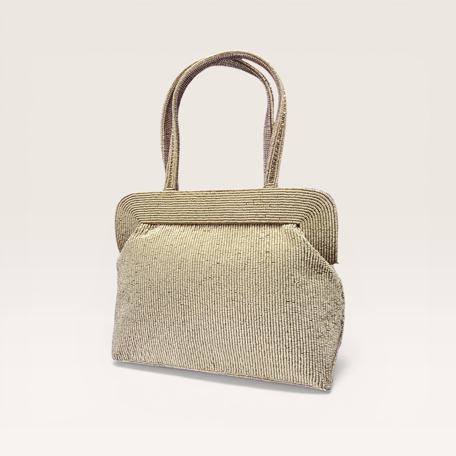 Hand-embroidered seed bead handbag with colorful stone border and twin embroidered handles.