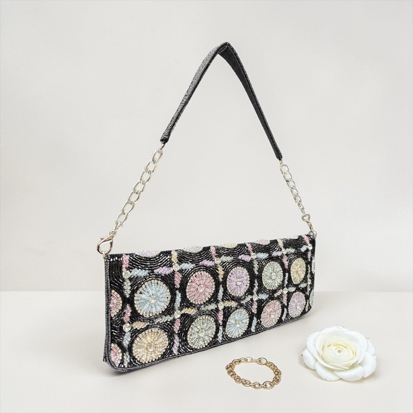 Hand-embroidered pastel bead envelope clutch with gold chain and Kardana work.
