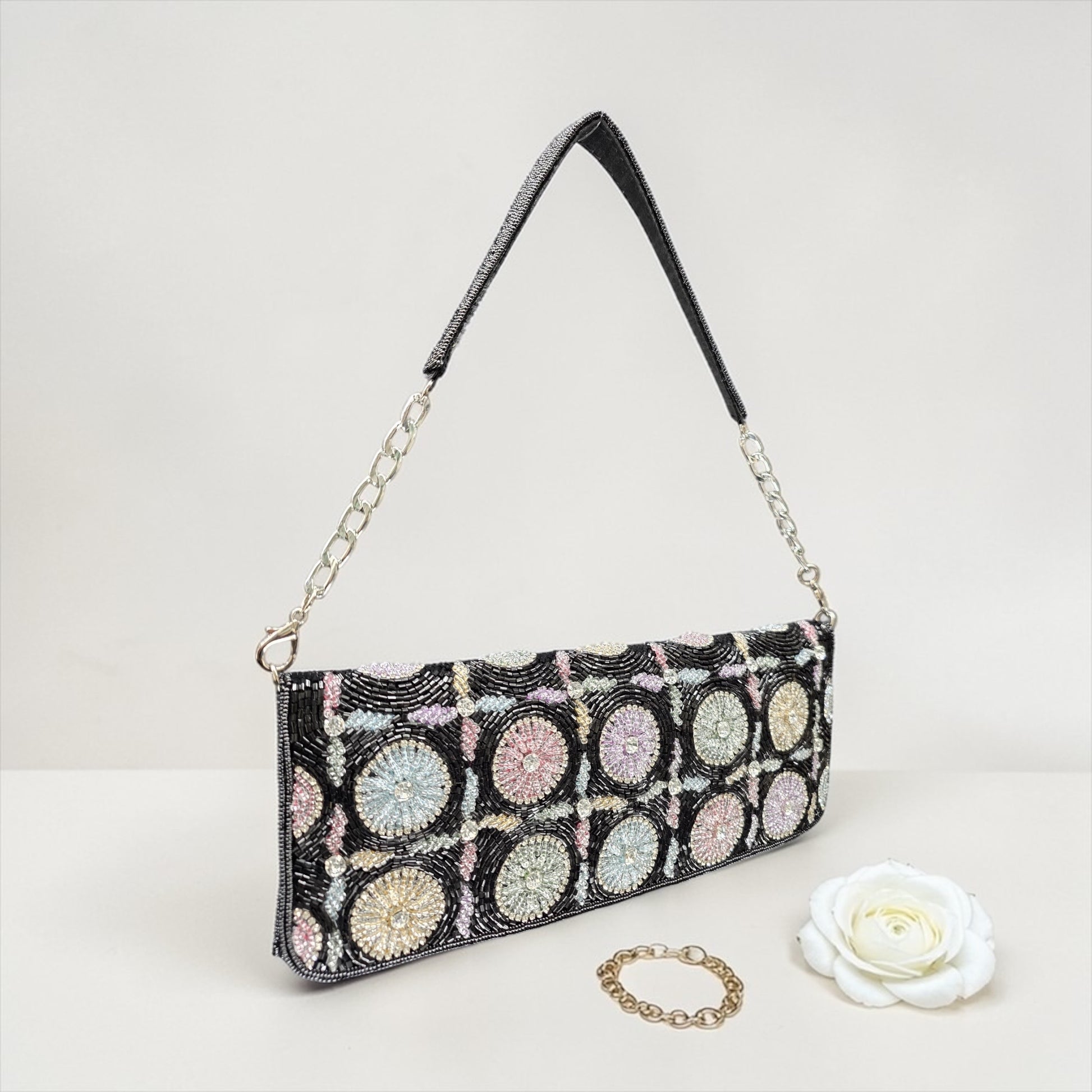 Hand-embroidered pastel bead envelope clutch with gold chain and Kardana work.