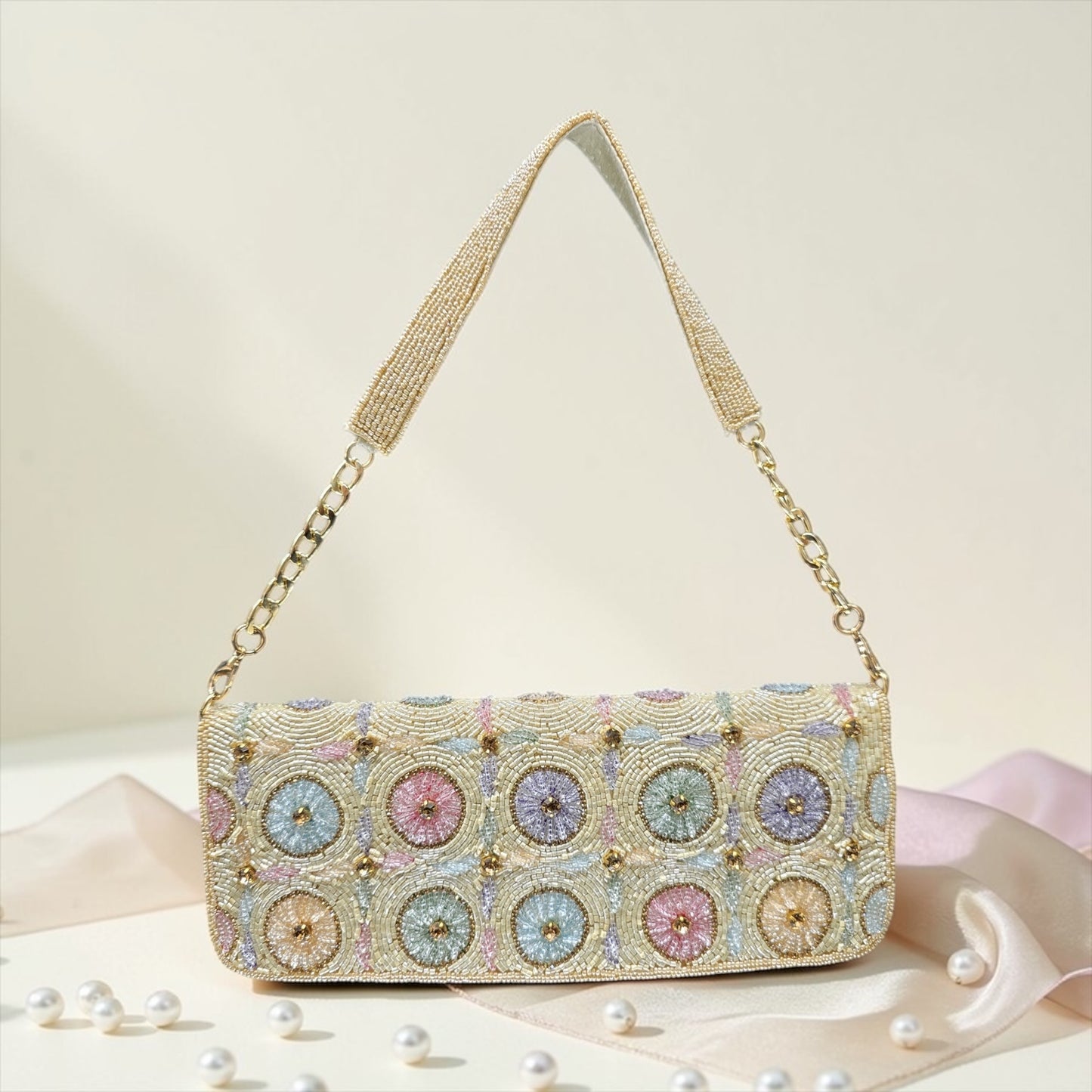 Hand-embroidered pastel bead envelope clutch with gold chain and Kardana work.