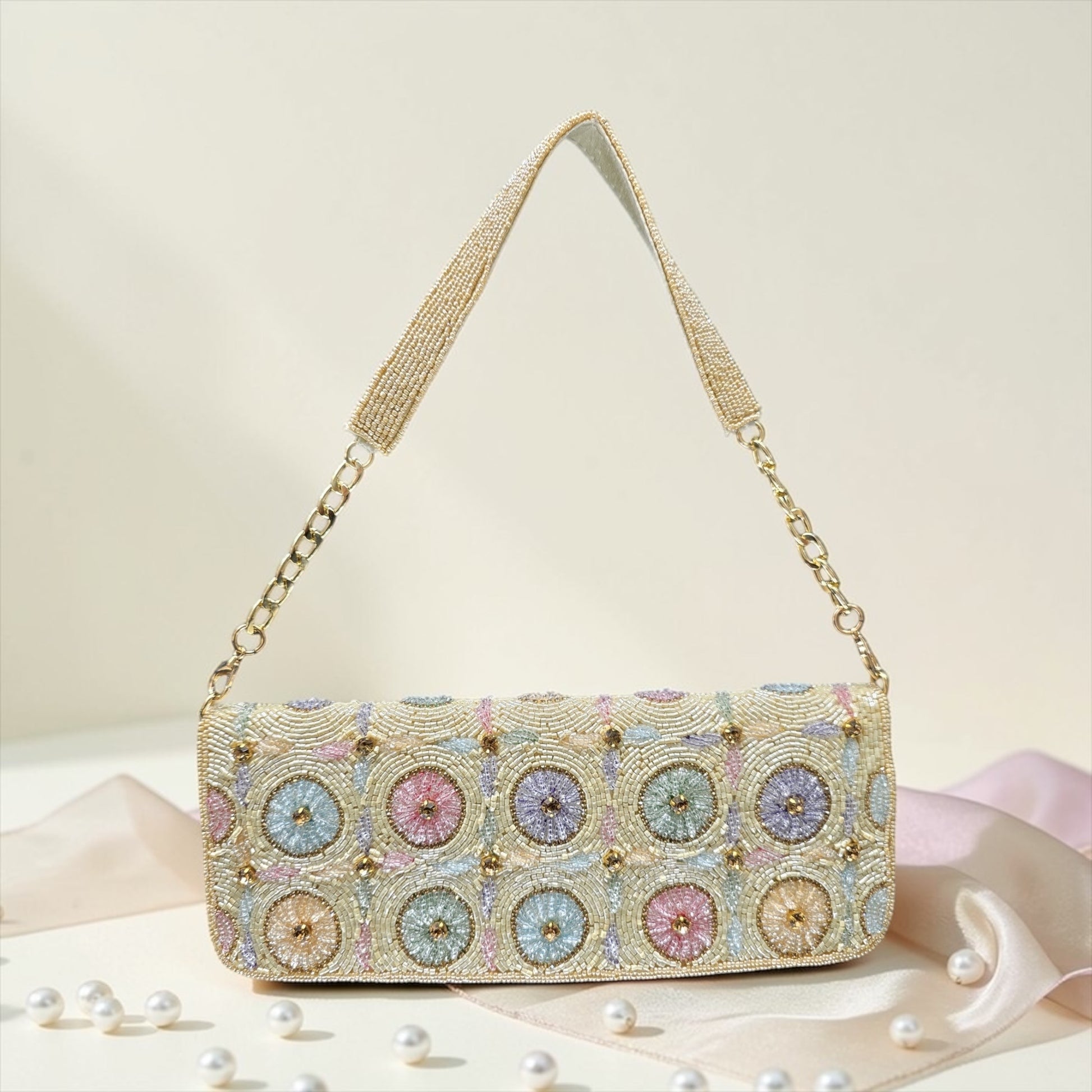 Hand-embroidered pastel bead envelope clutch with gold chain and Kardana work.