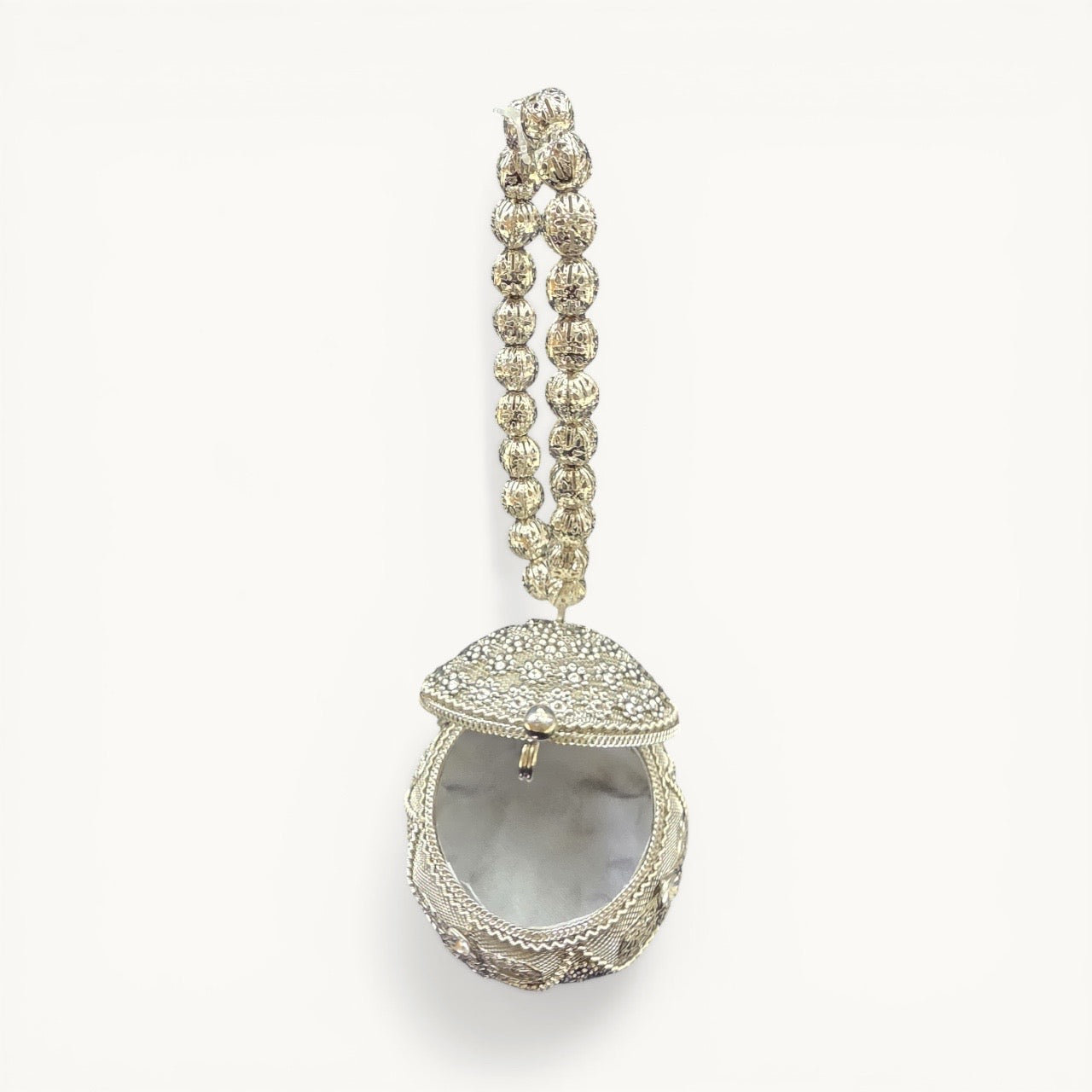 Aura kari Nariyal-Shaped Silver Mini Brass Clutch