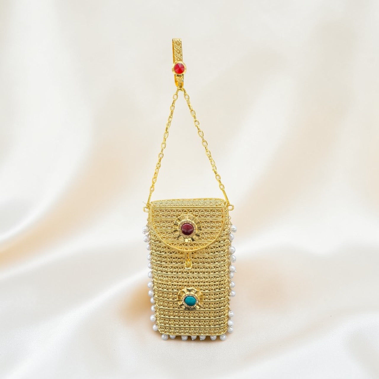 Luxury gold clutch purse with chain strap and pearl detailing for festive wear