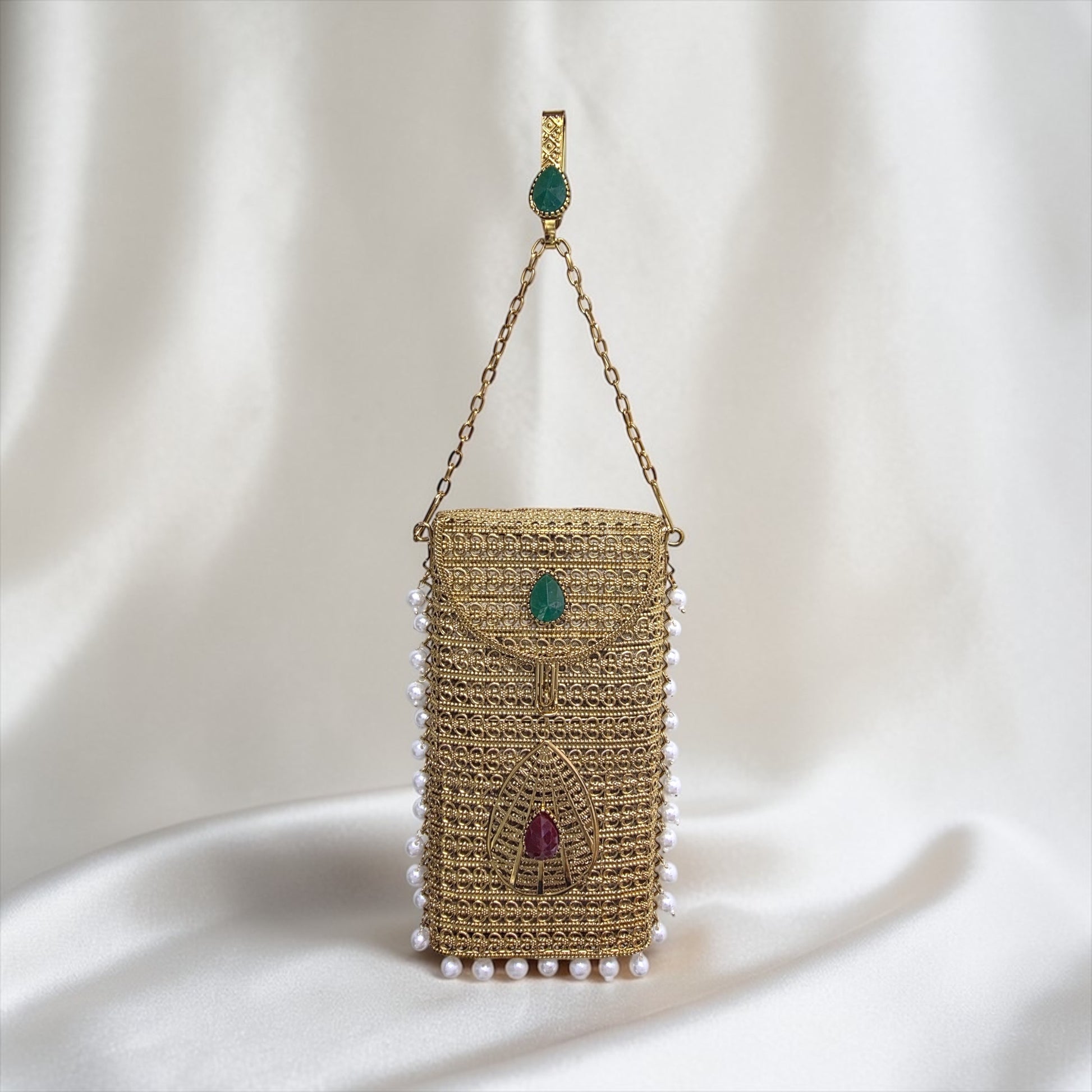 Antique Gold brass mobile clutch with coloured teardrop stone and pearl tassels, luxury wedding phone bag
Designer brass phone clutch with pearl hangings and drop shaped stone detailing, ethnic party wear handbag