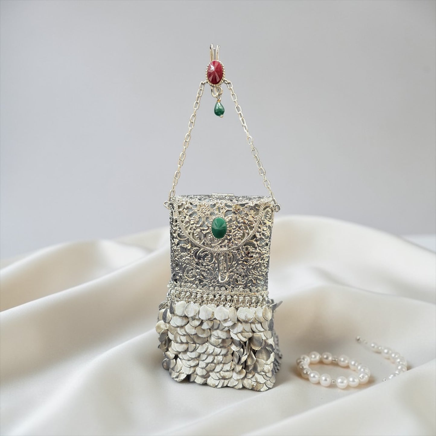 brass waist mobile clutch with danglers
gold metal wedding clutch with waist hook
designer Indian brass clutch bag
trending bridal mobile clutch silver