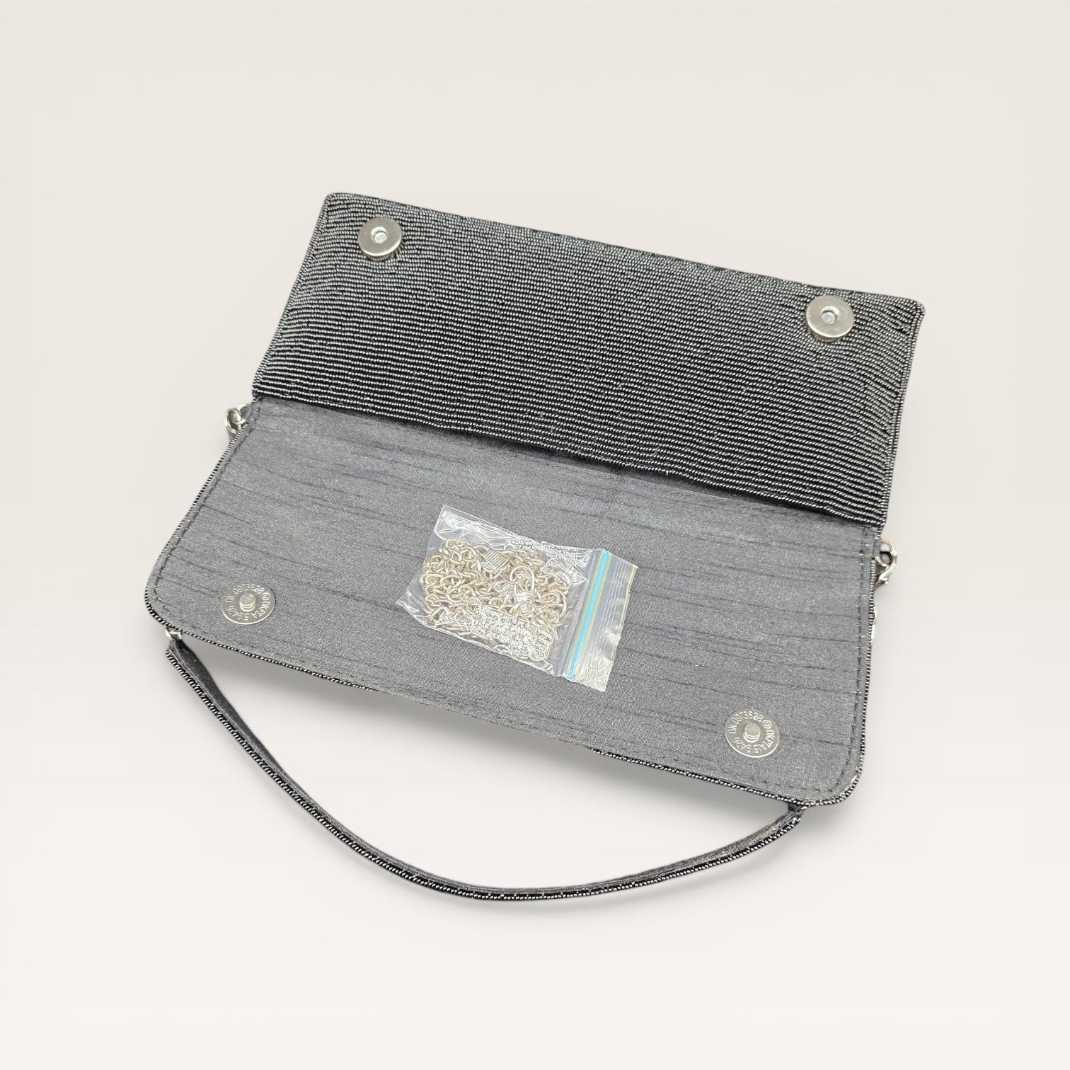 Hand-embroidered pastel bead envelope clutch with gold chain and Kardana work.