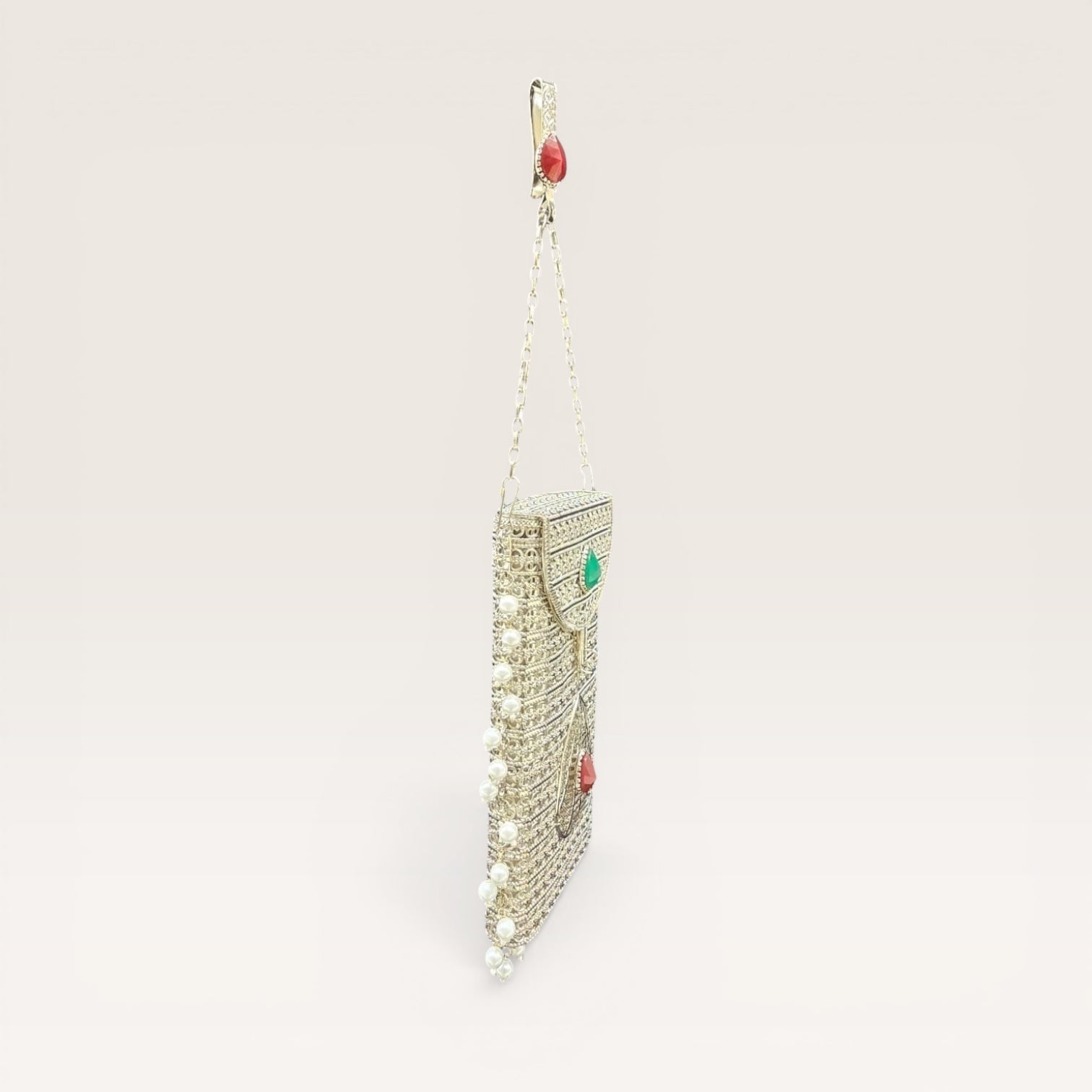 Handcrafted brass clutch with pearl fringes and teardrop stone design, festive mobile pouch bag
Luxury brass mobile clutch with intricate detailing, pearl hangings and coloured stone embellishment