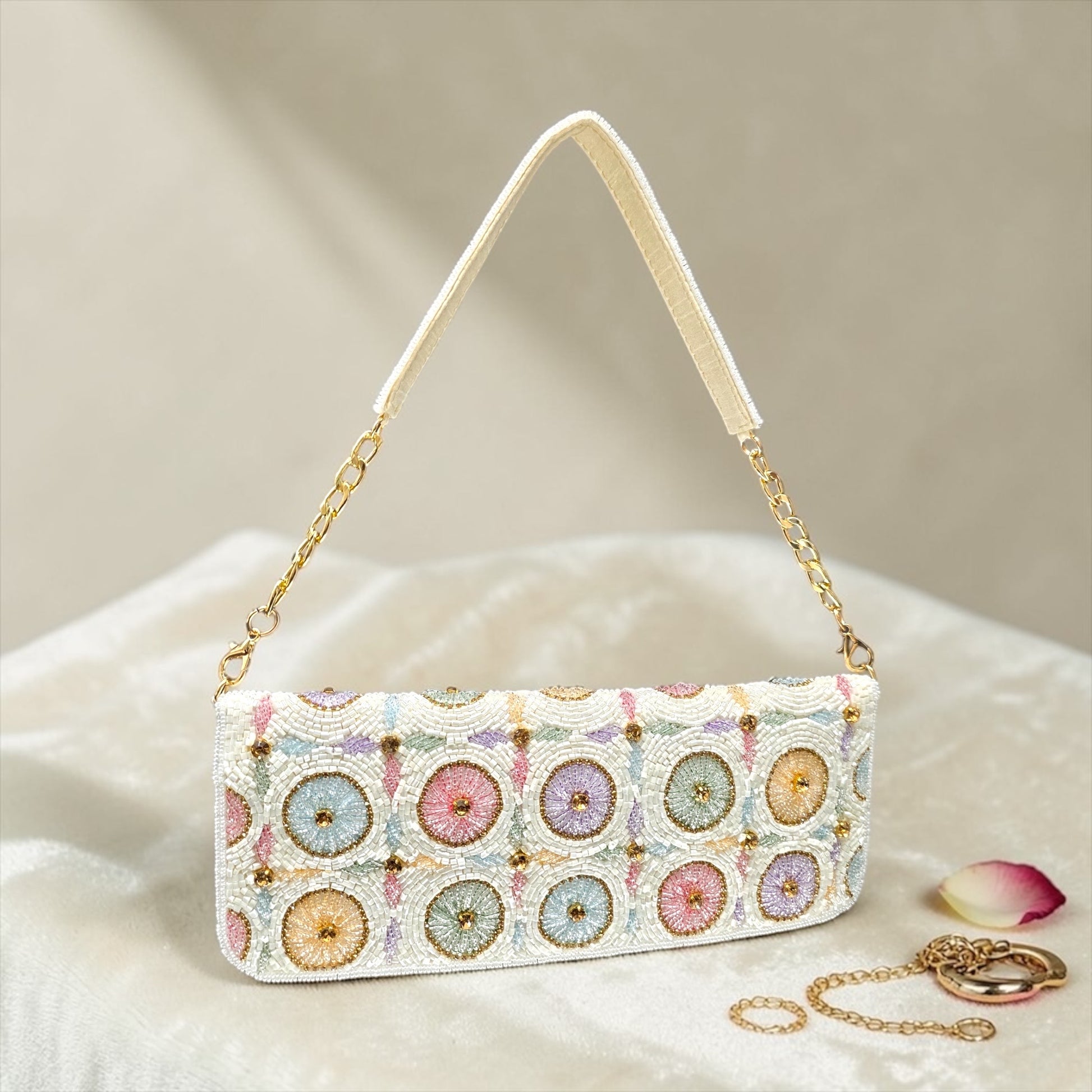 Hand-embroidered pastel bead envelope clutch with gold chain and Kardana work.