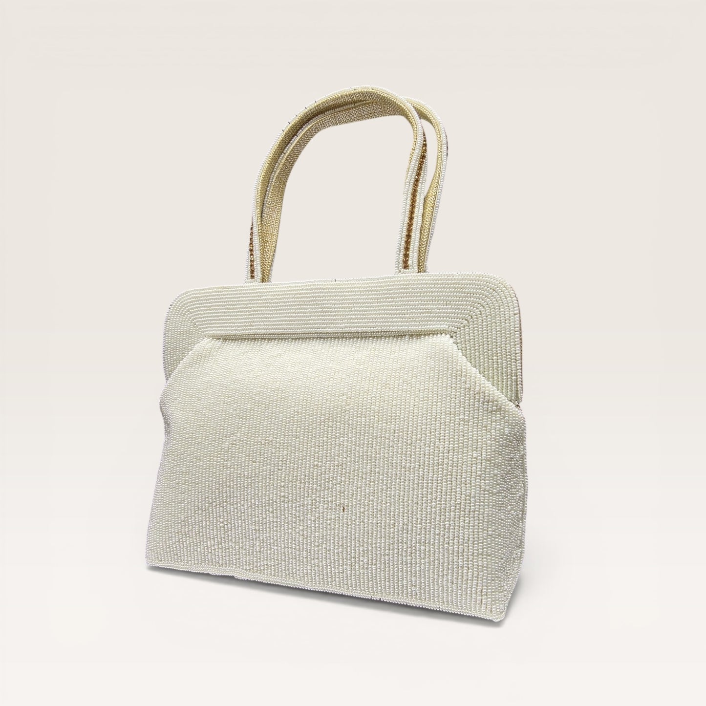 Hand-embroidered seed bead handbag with colorful stone border and twin embroidered handles.