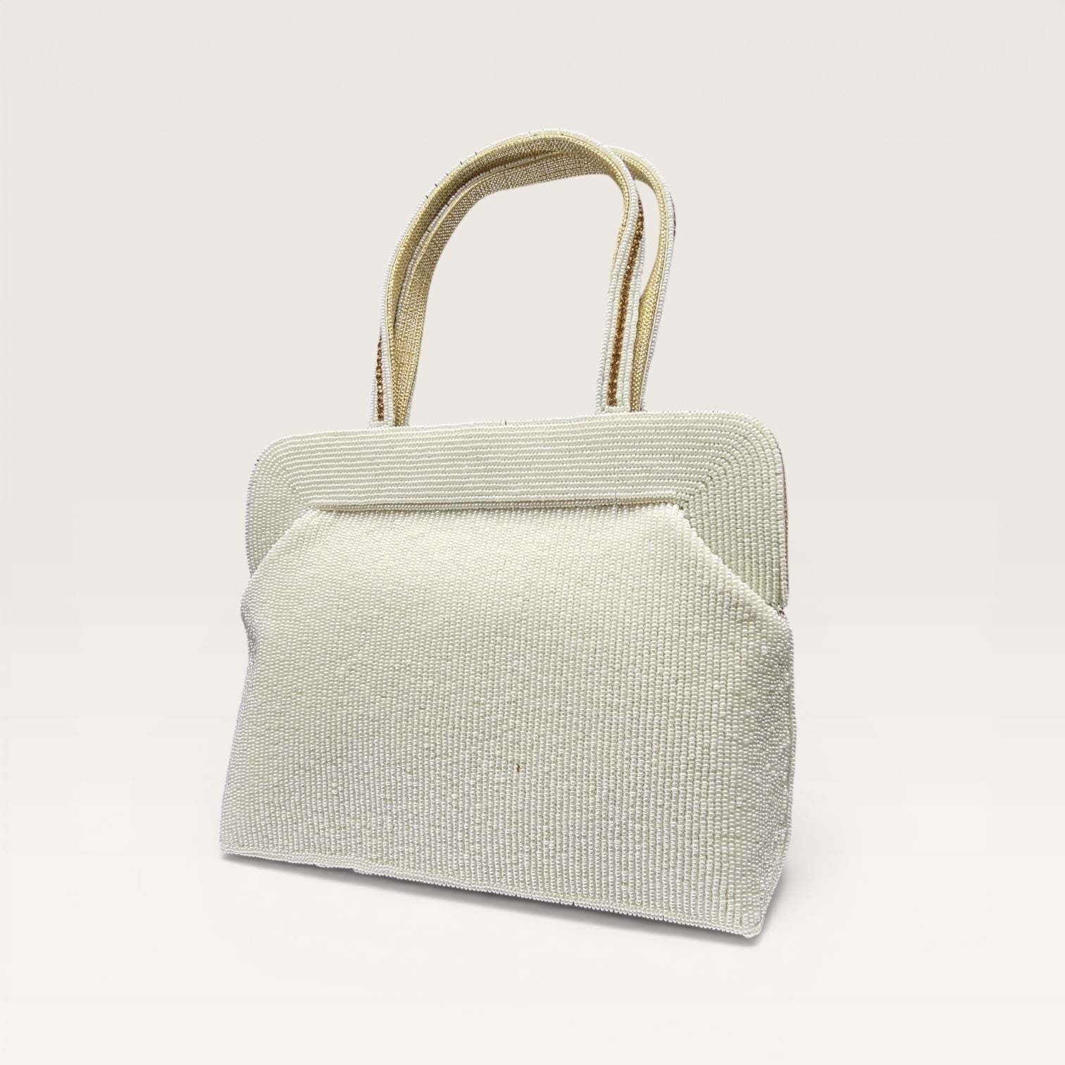 Hand-embroidered seed bead handbag with colorful stone border and twin embroidered handles.