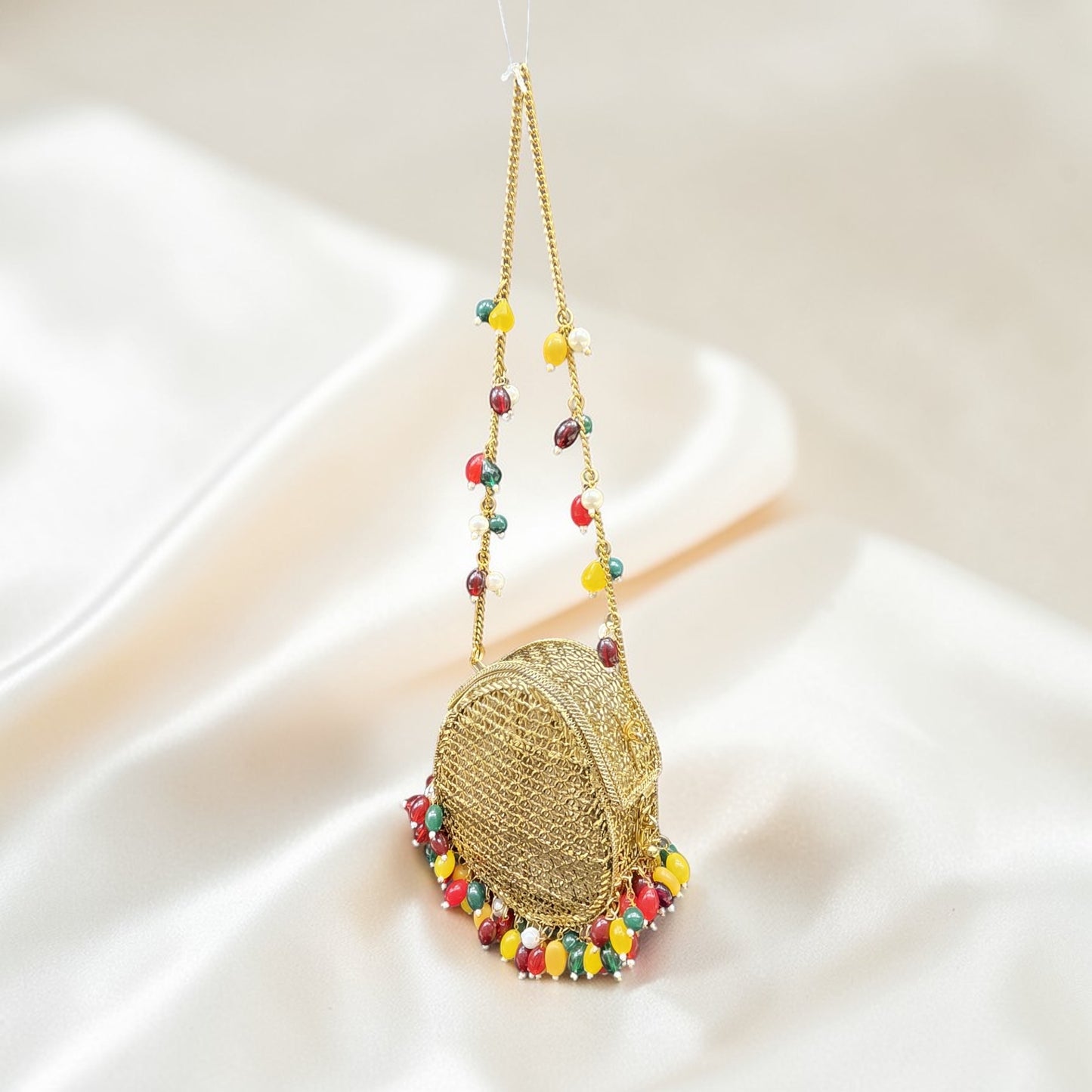 Brass metal party wear clutch with multi-color drop beads and chain handle for weddings.
