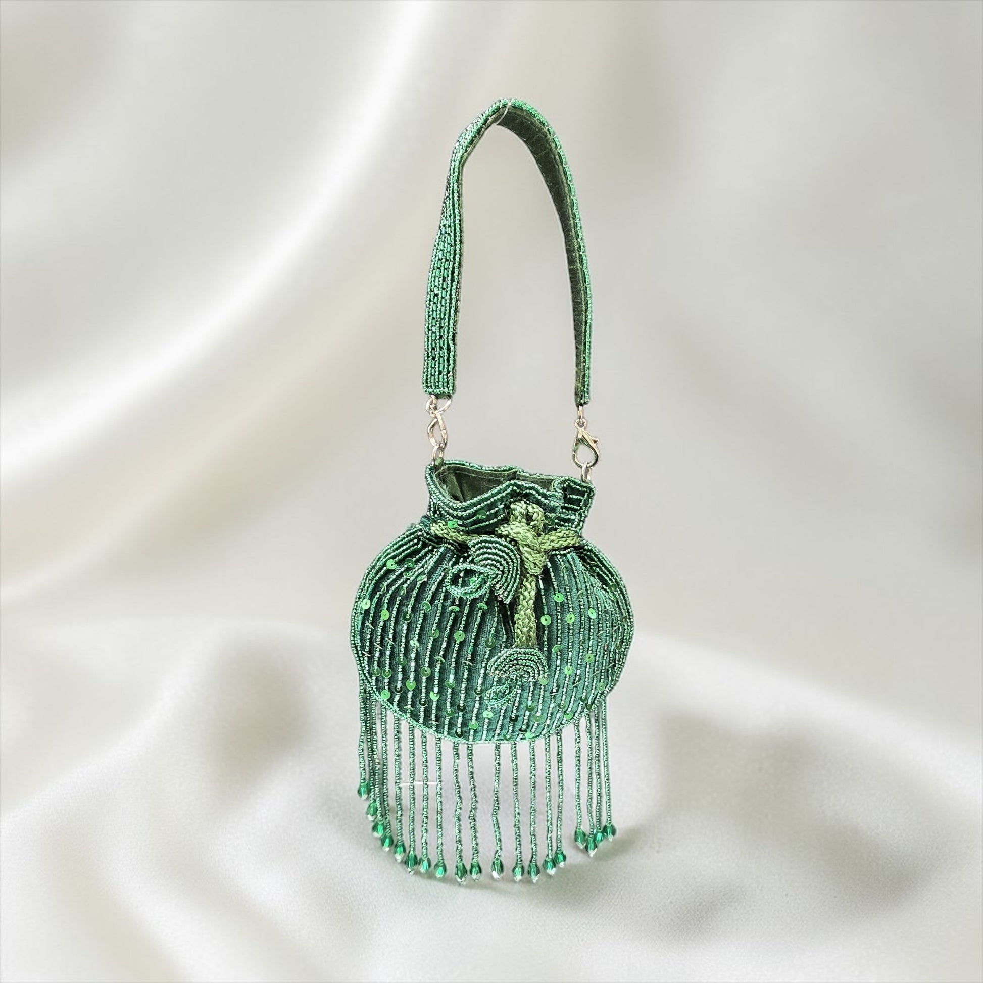 Mini velvet potli bag with seed beads and shimmering sequin hand embroidery