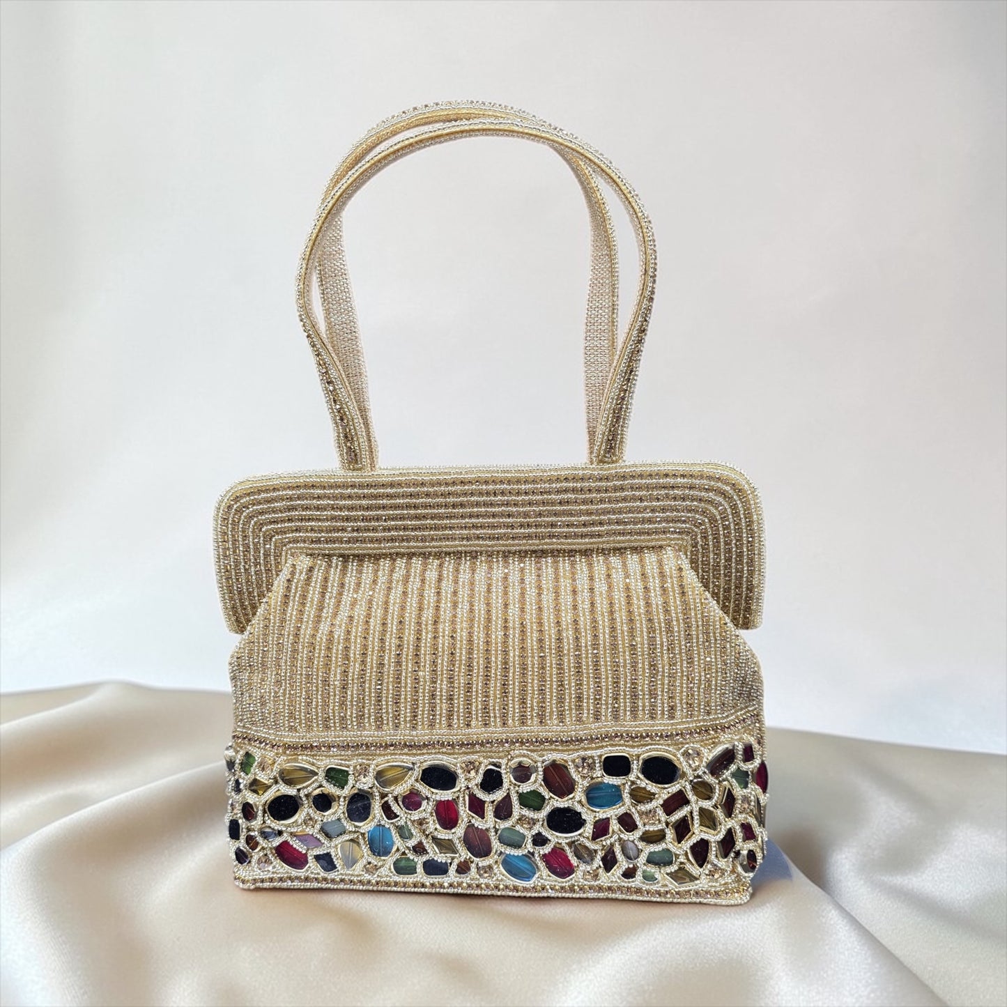 Hand-embroidered seed bead handbag with colorful stone border and twin embroidered handles.