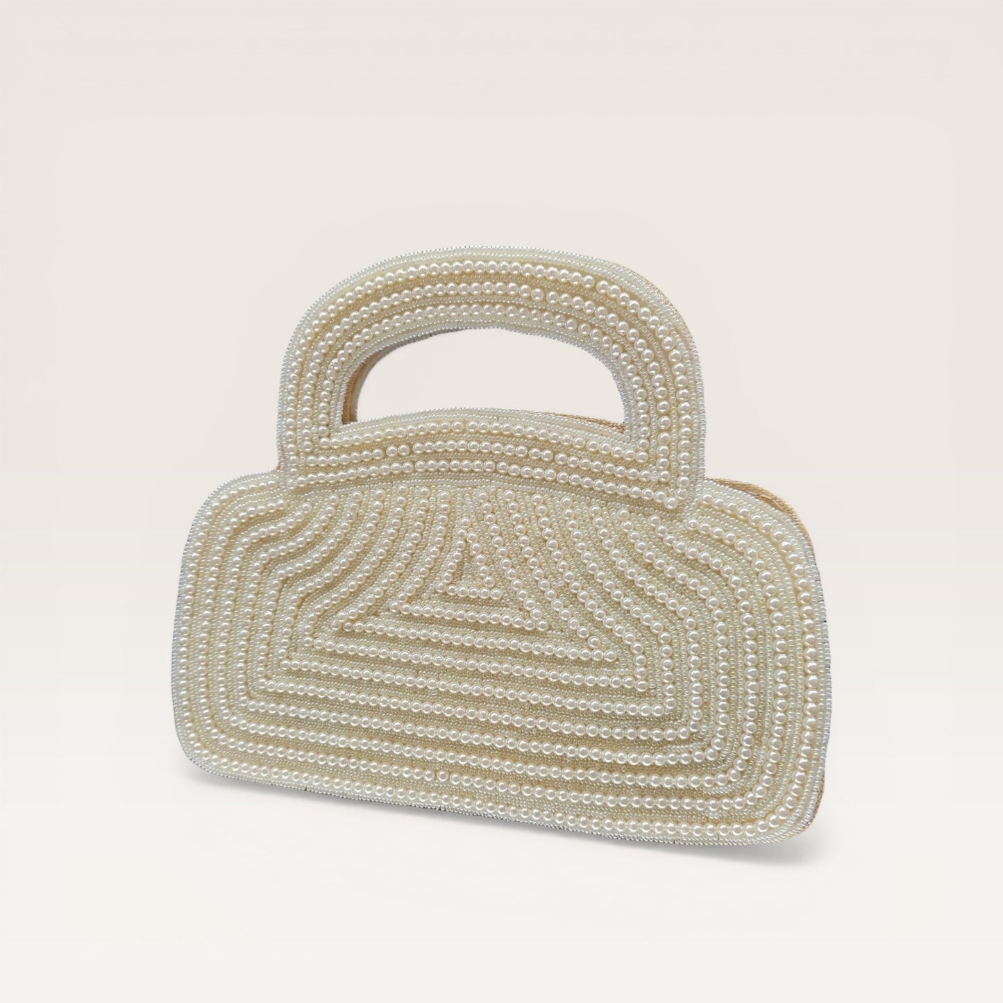 Dual-sided hand-embroidered luxury wedding bag featuring a central mother-of-pearl floral motif and a geometric pearl pattern on a natural jute base. This mini bucket-style bridal clutch includes a secure zip closure and an integrated hand-beaded handle, perfect for ethnic and festive wear