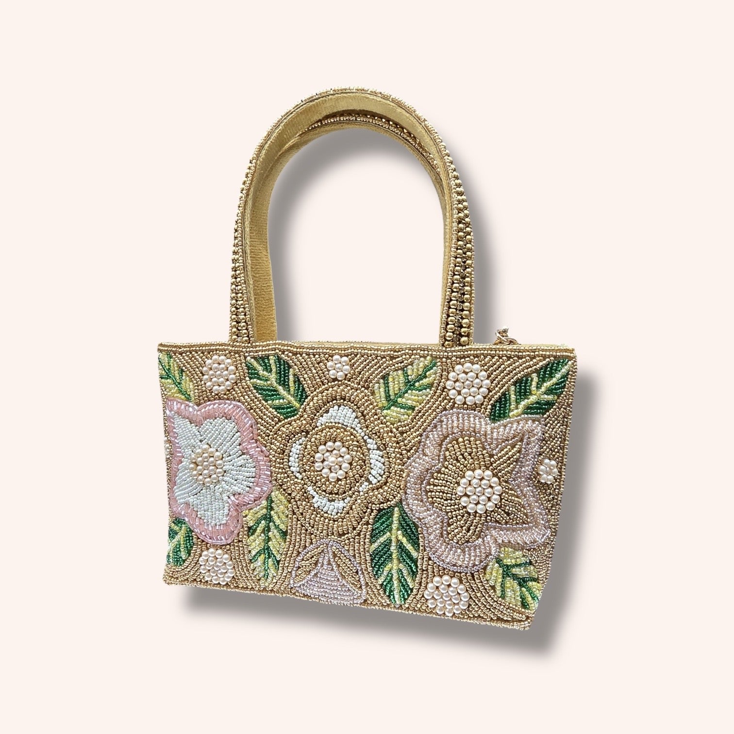 Hand-embroidered bucket bag with colorful floral beadwork and twin handles on a velvet base.