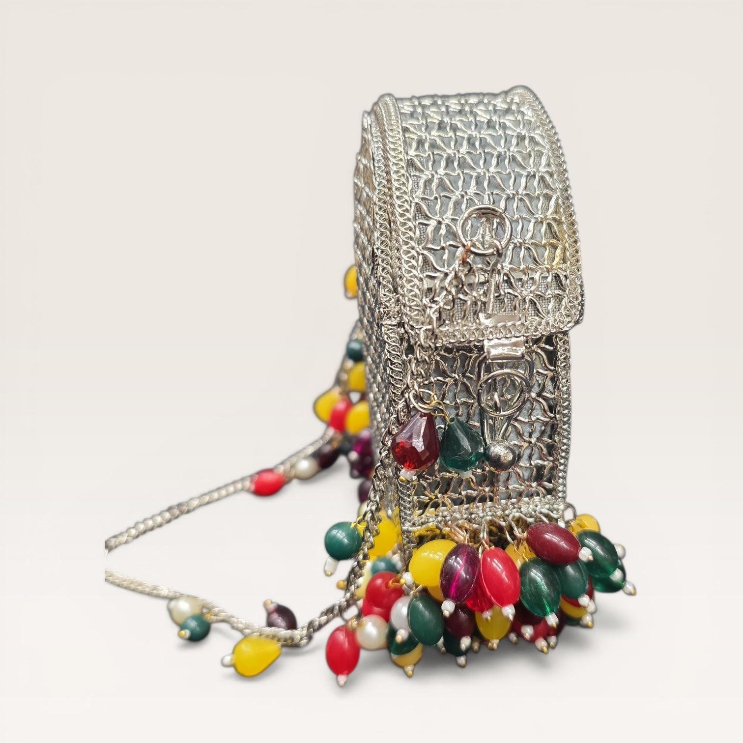 Brass metal party wear clutch with multi-color drop beads and chain handle for weddings.