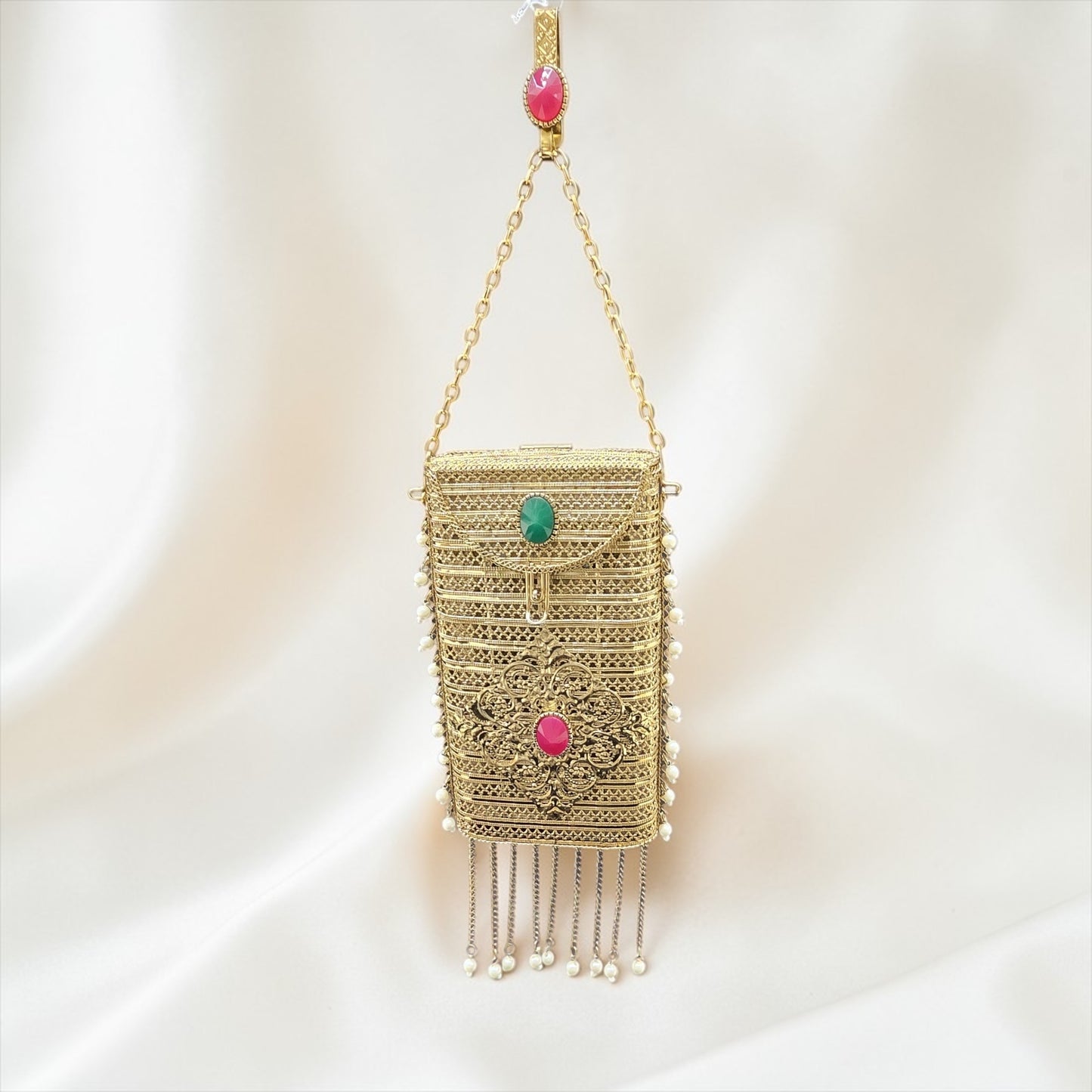 designer brass mobile clutch Indian wedding bag
gold clutch with tassel chains and stone detailing