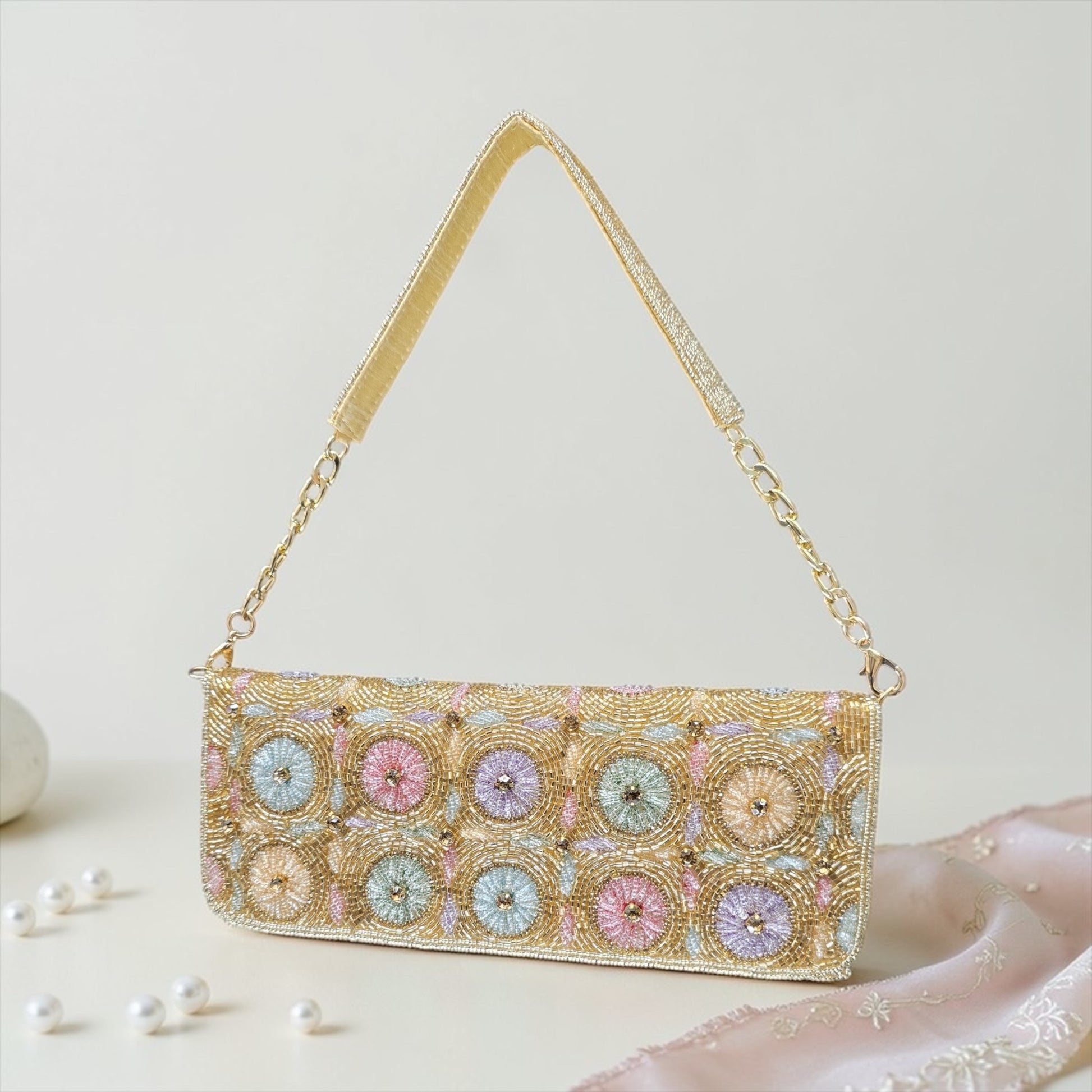 Hand-embroidered pastel bead envelope clutch with gold chain and Kardana work.