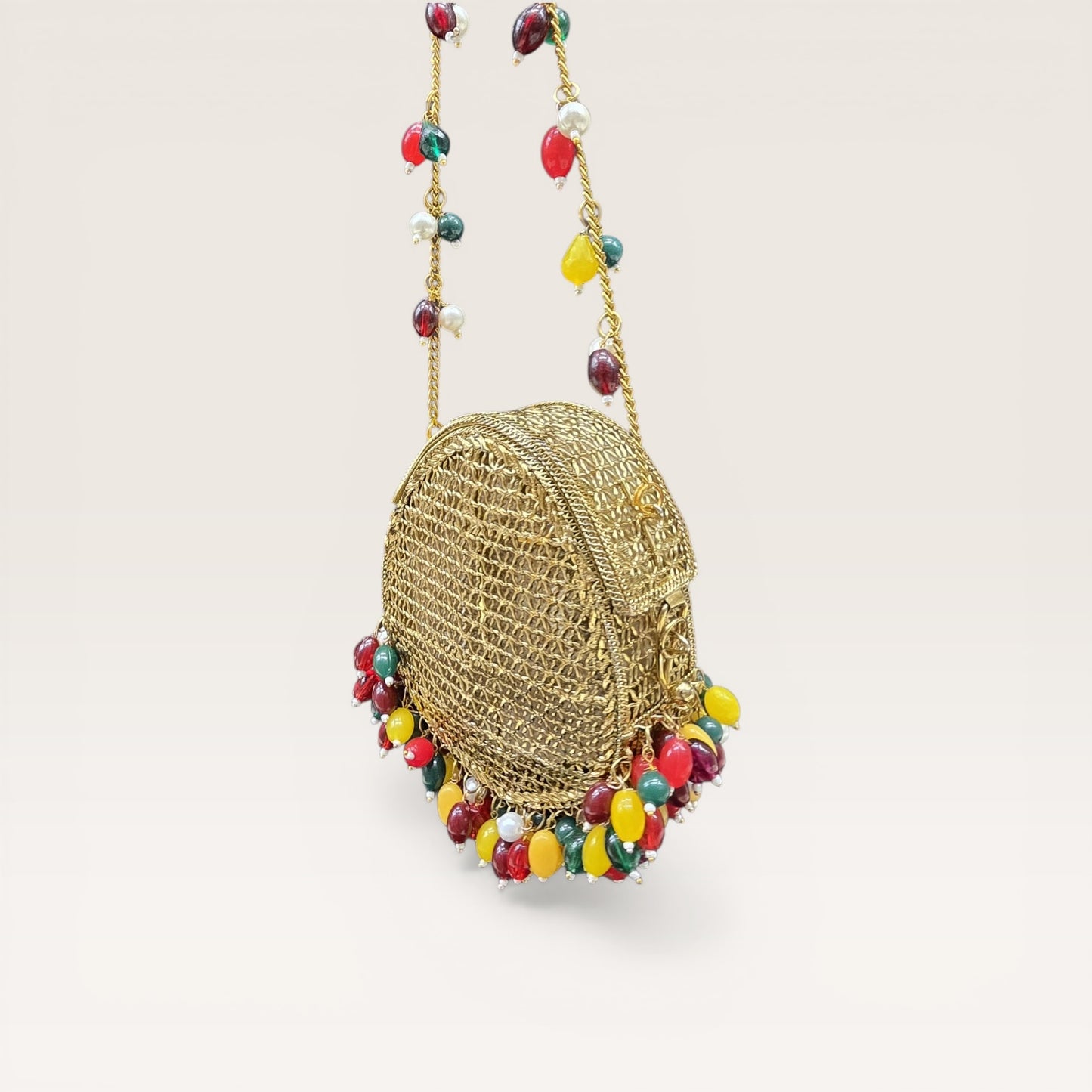 Brass metal party wear clutch with multi-color drop beads and chain handle for weddings.