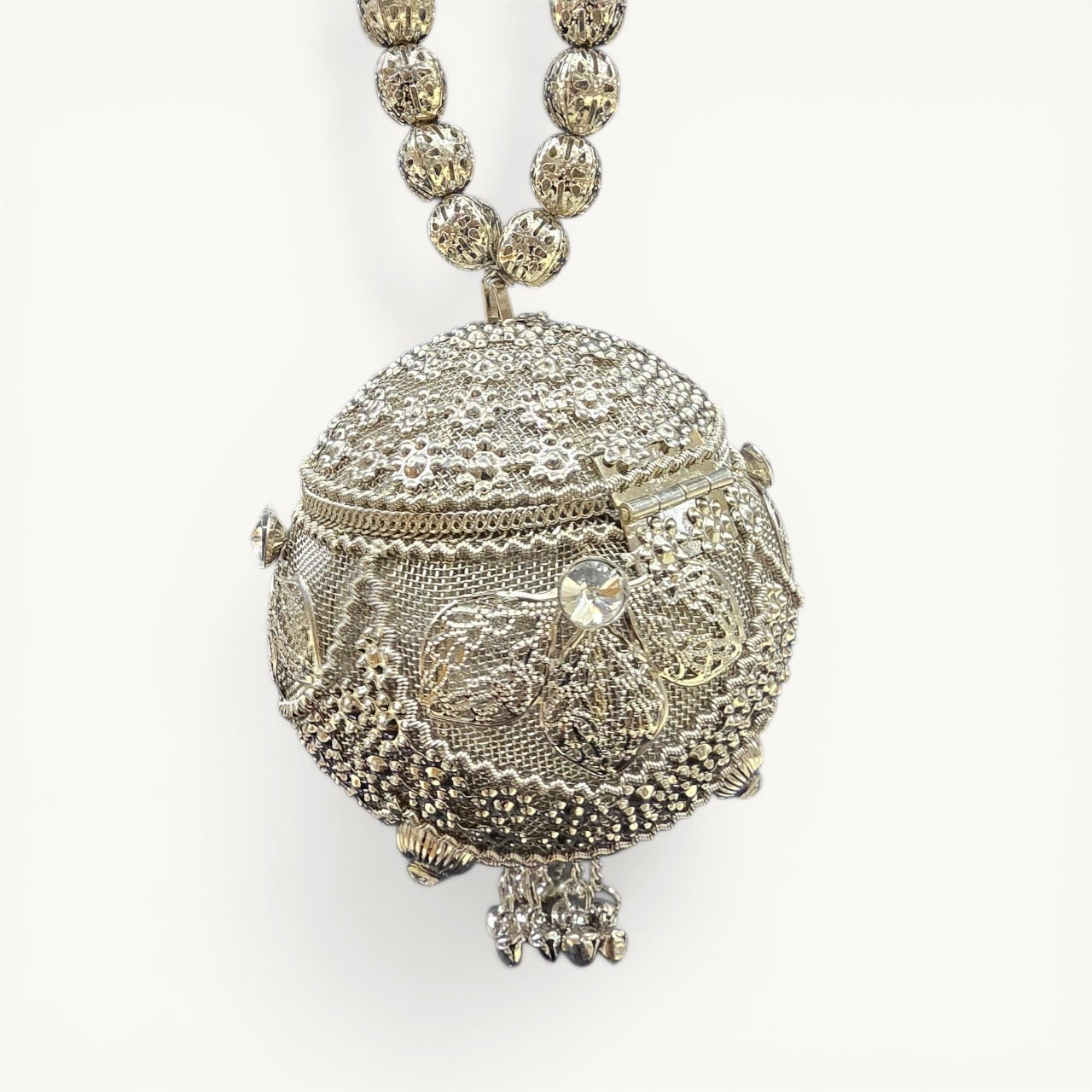 Aura kari Nariyal-Shaped Silver Mini Brass Clutch