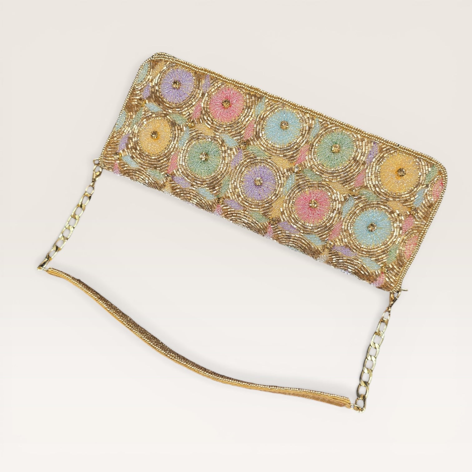 Hand-embroidered pastel bead envelope clutch with gold chain and Kardana work.