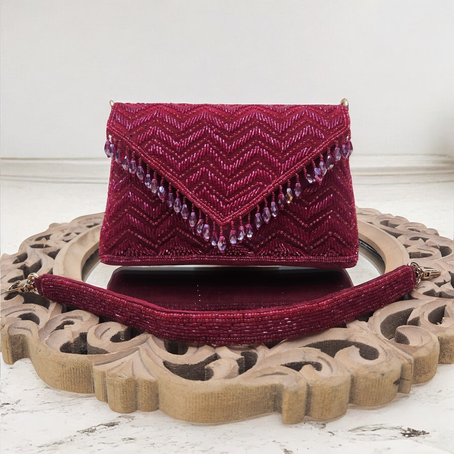 Swarnima Maroon Flapover Clutch