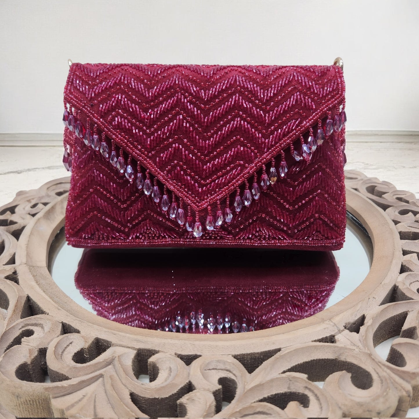 Swarnima Maroon Flapover Clutch